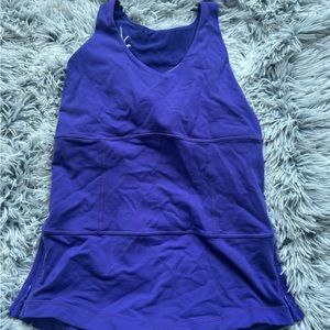 Lululemon tank top set of four. Size 6/8 built in bra.